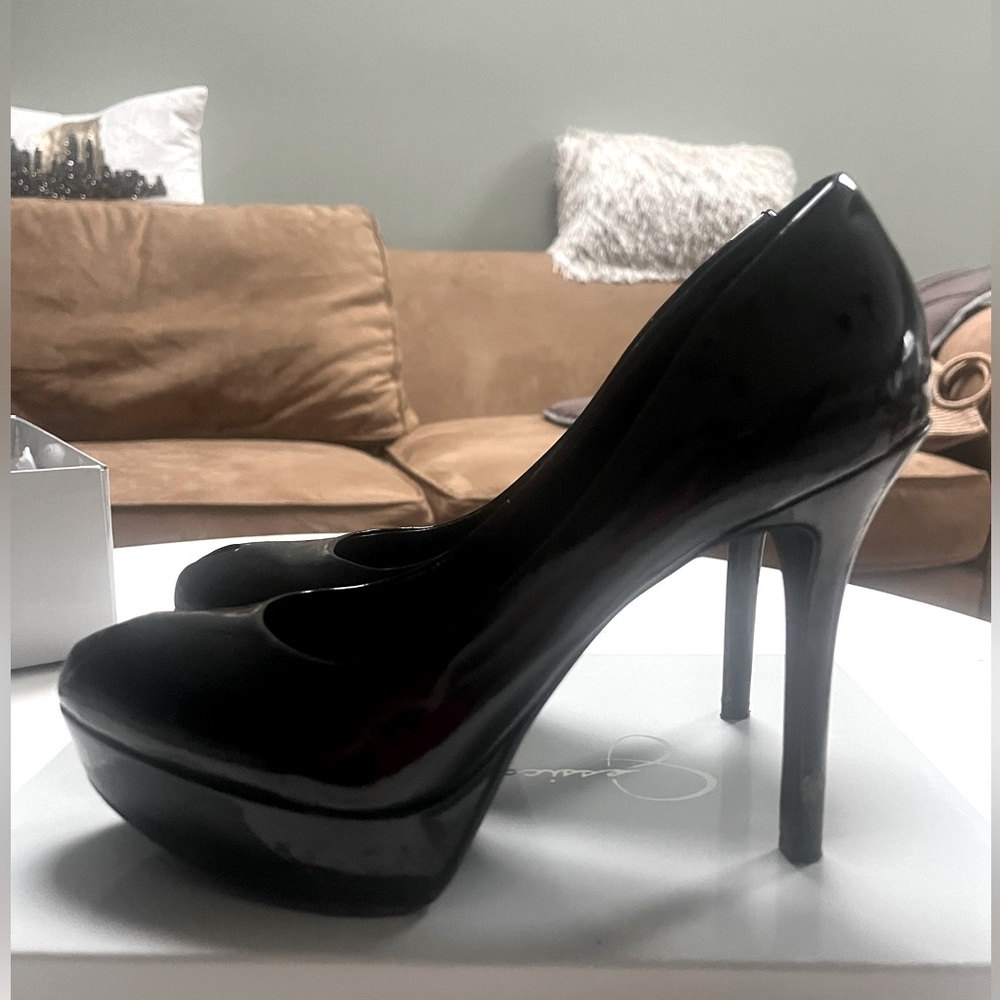 Black patent leather peep toe pumps